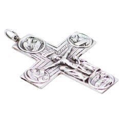 Silver crucifix with reliefs alluding to Jesus Christ