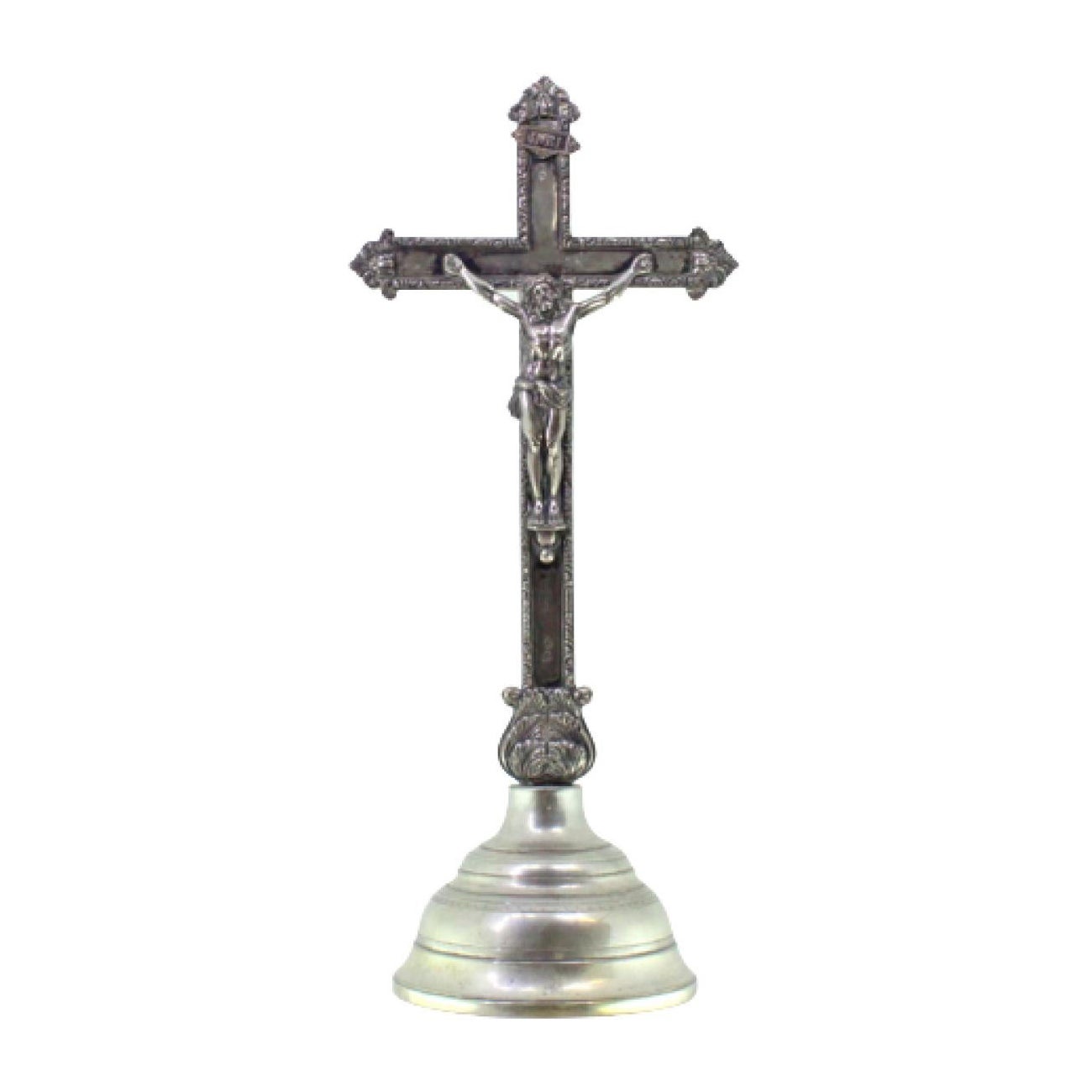 Silver crucifix with reliefs, resting on a plinth with friezes around it