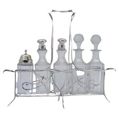 Silver cruet stand with salt, pepper, mustard pot 
lid holder