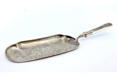 Silver crumb catcher w/ floral engravings, coat of arms & pearly frieze