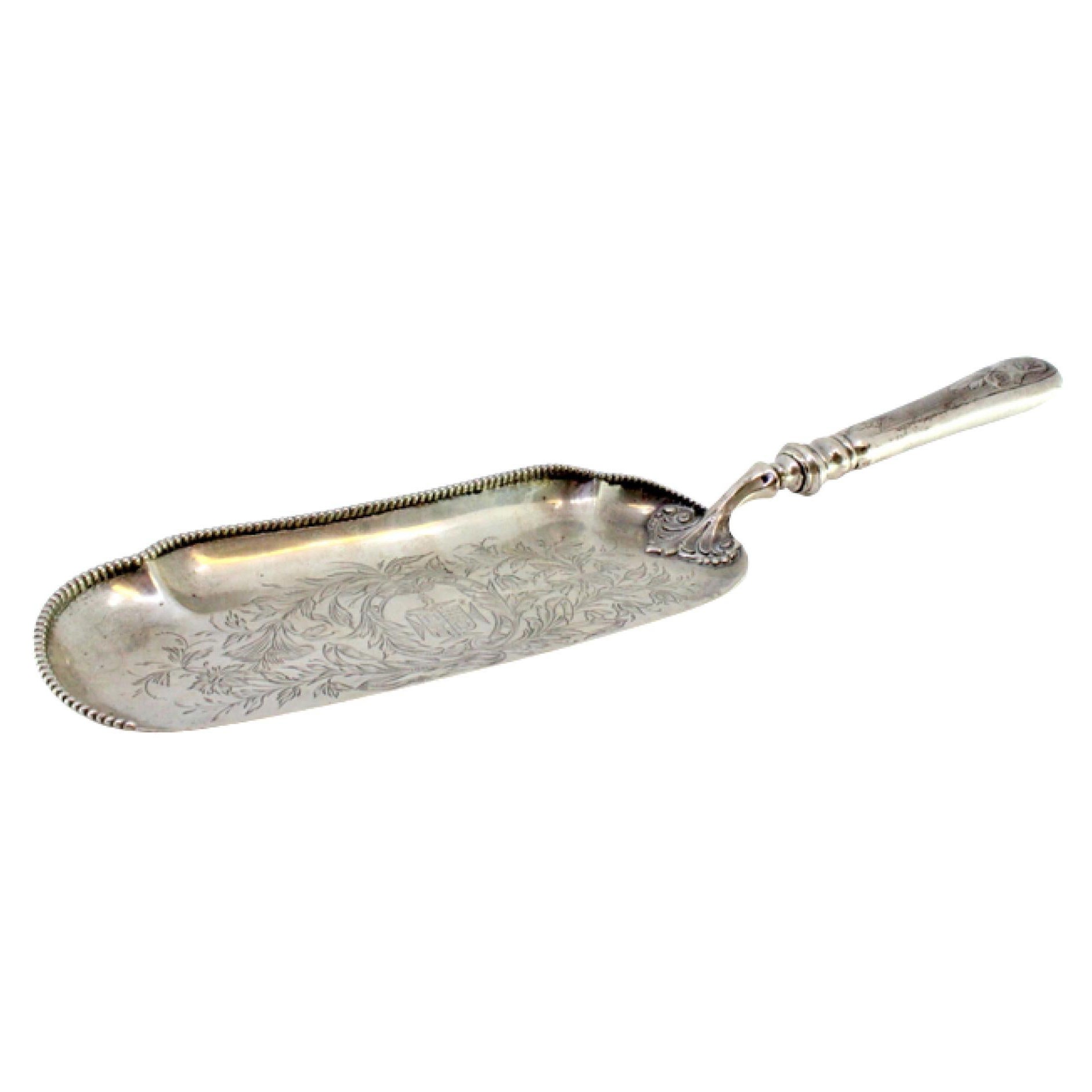 Silver crumb catcher w/ floral engravings, coat of arms
pearly frieze