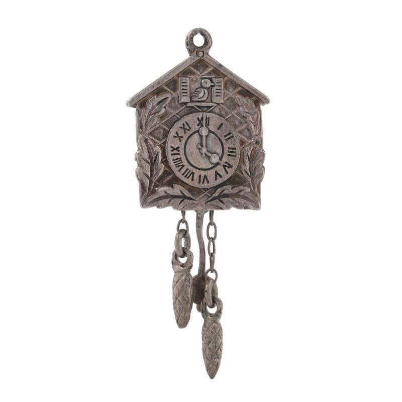 Metal Content: 800 Silver

Theme: Cuckoo Clock 
Features:  The pendulum and weights move.

Measurements

Tall (from stationary bail): 1 17/32