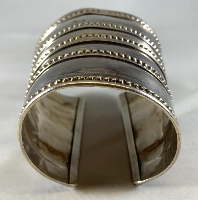 Silver Cuff, Rajasthan, India

An antique silver cuff from Rajasthan (Rabari people) with a decorative dot design and border. It measures 8