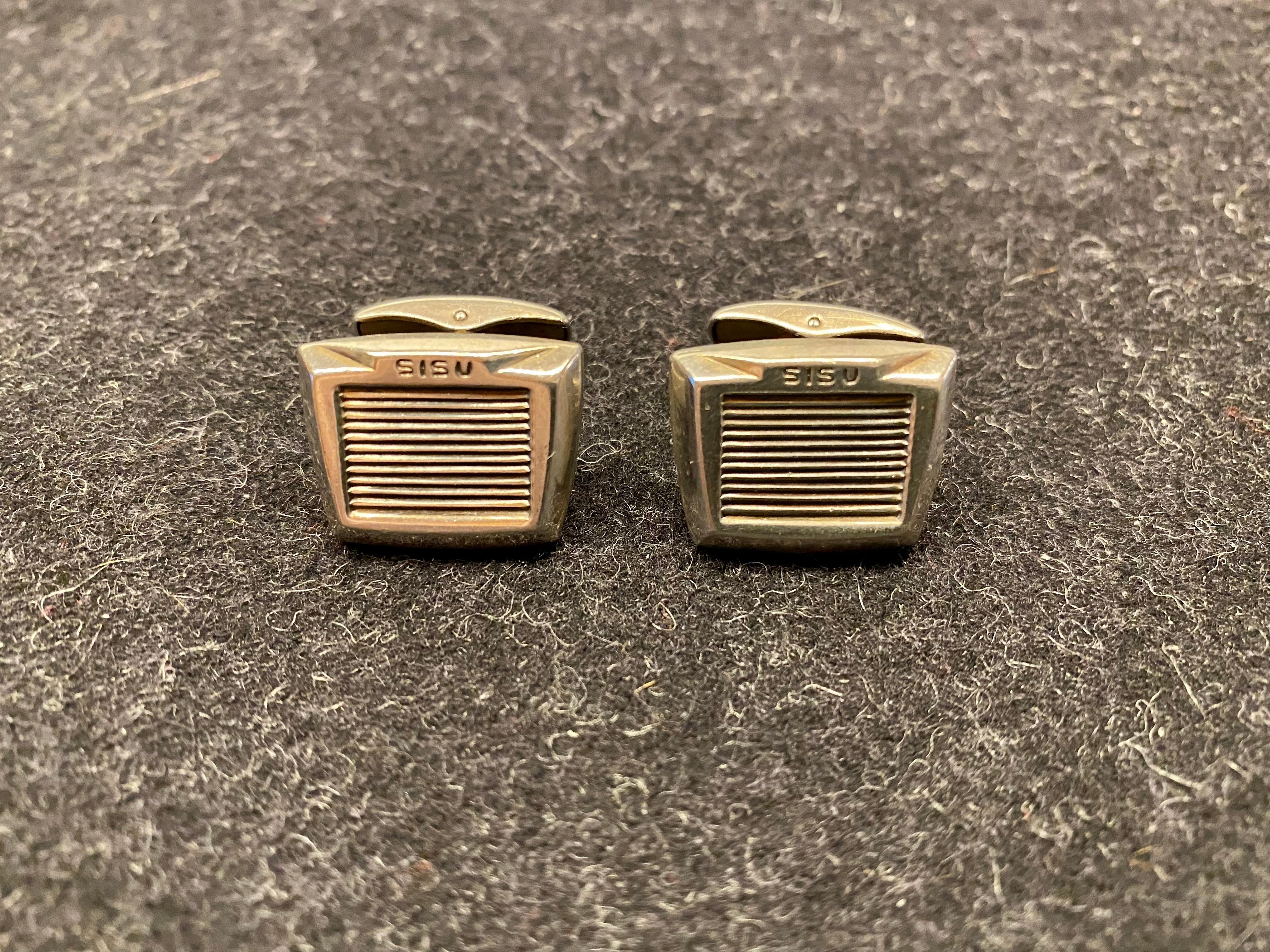 Silver Cufflinks Finland 1963 
Here's A Truck Cufflinks For A Great Gift For A Man Or Woman
Turku Finland Alpo Tammi AKT 1959-1967
Sisu,
1963
830 H Silver
No engravings.
Great cufflinks.

Sisu Is a Finnish Truck.

Below is historical information