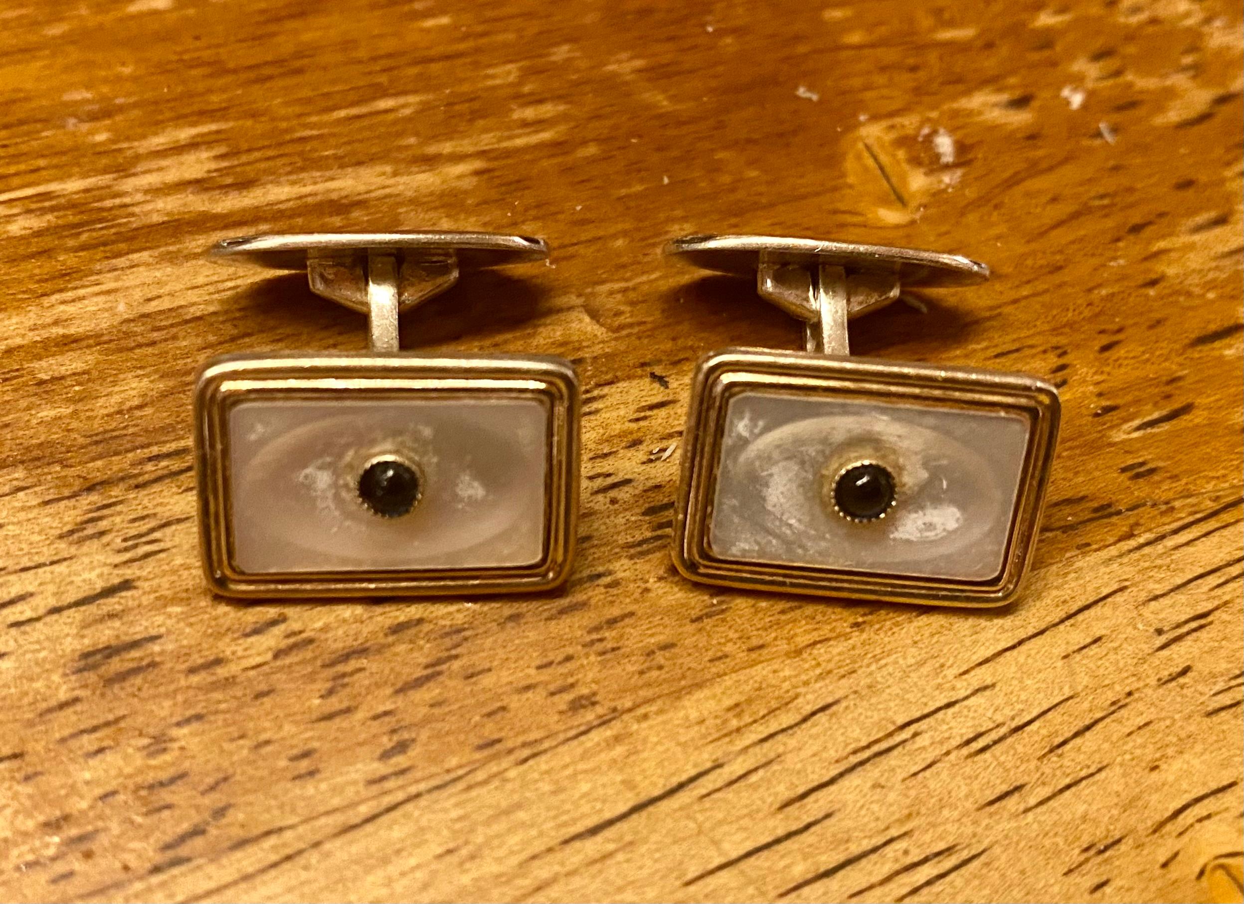 Silver Cufflinks Modern Swedish 
Scandinavian design
Swedish stamps.
Three Crowns
Mother of pearl and blue stones.
Silver 835S
Really nice ones.
Engraving on the back 