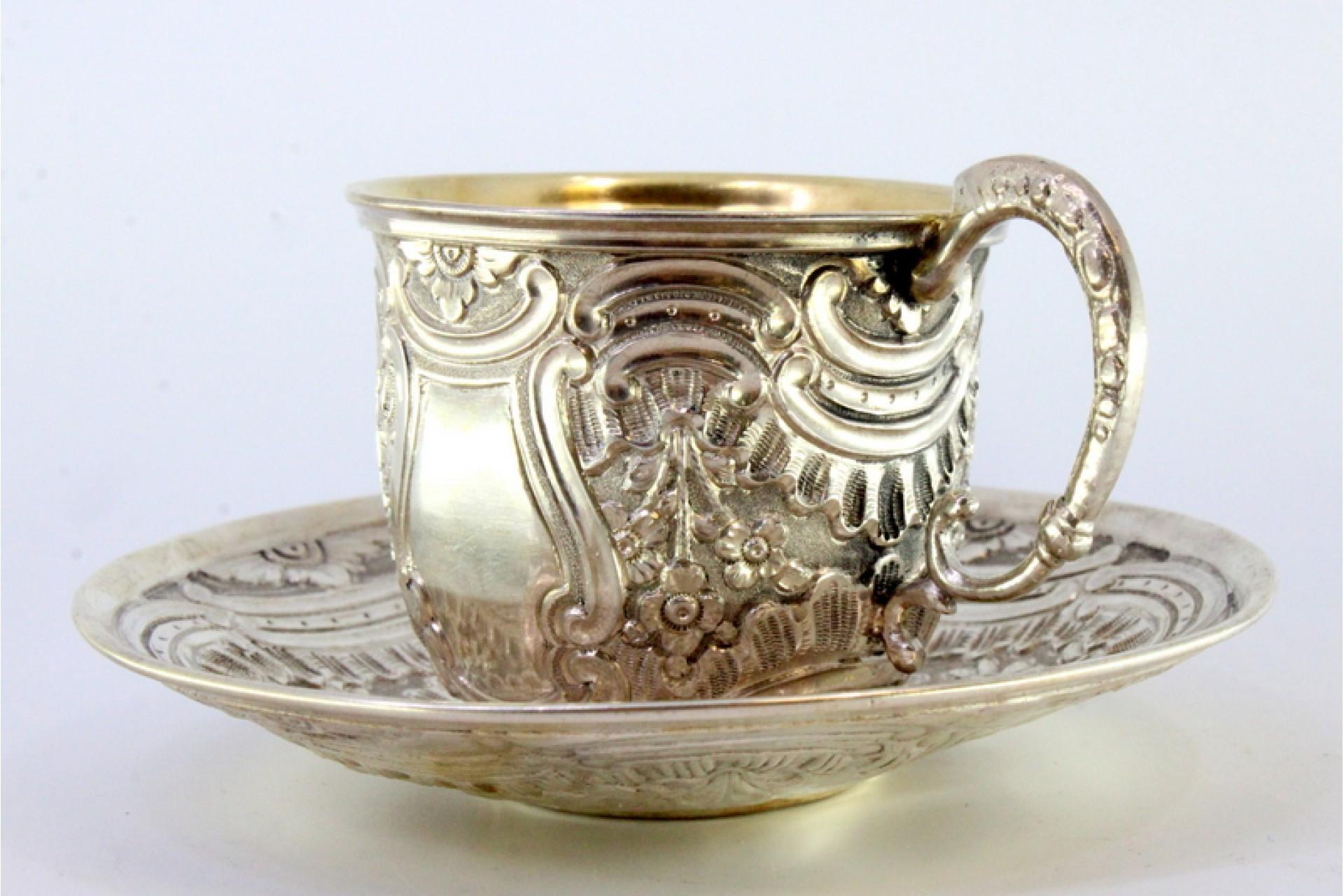 European Silver cup and saucer with reliefs and gold interior For Sale