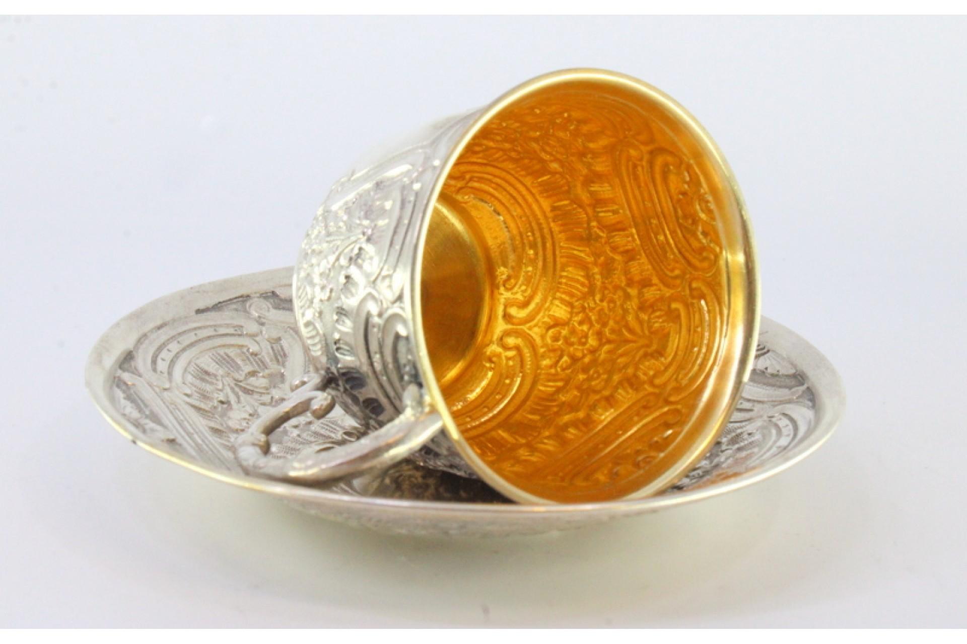 Silver cup and saucer with reliefs and gold interior For Sale 1