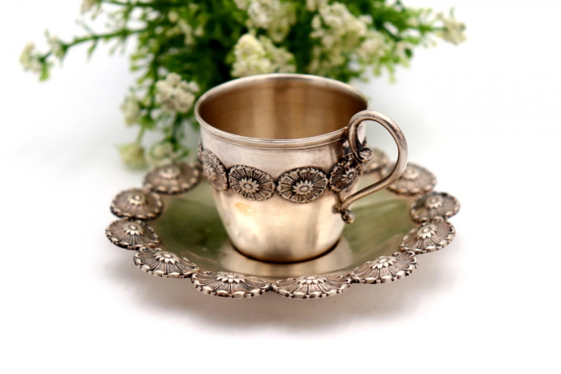 European Silver cup and saucer with reliefs For Sale