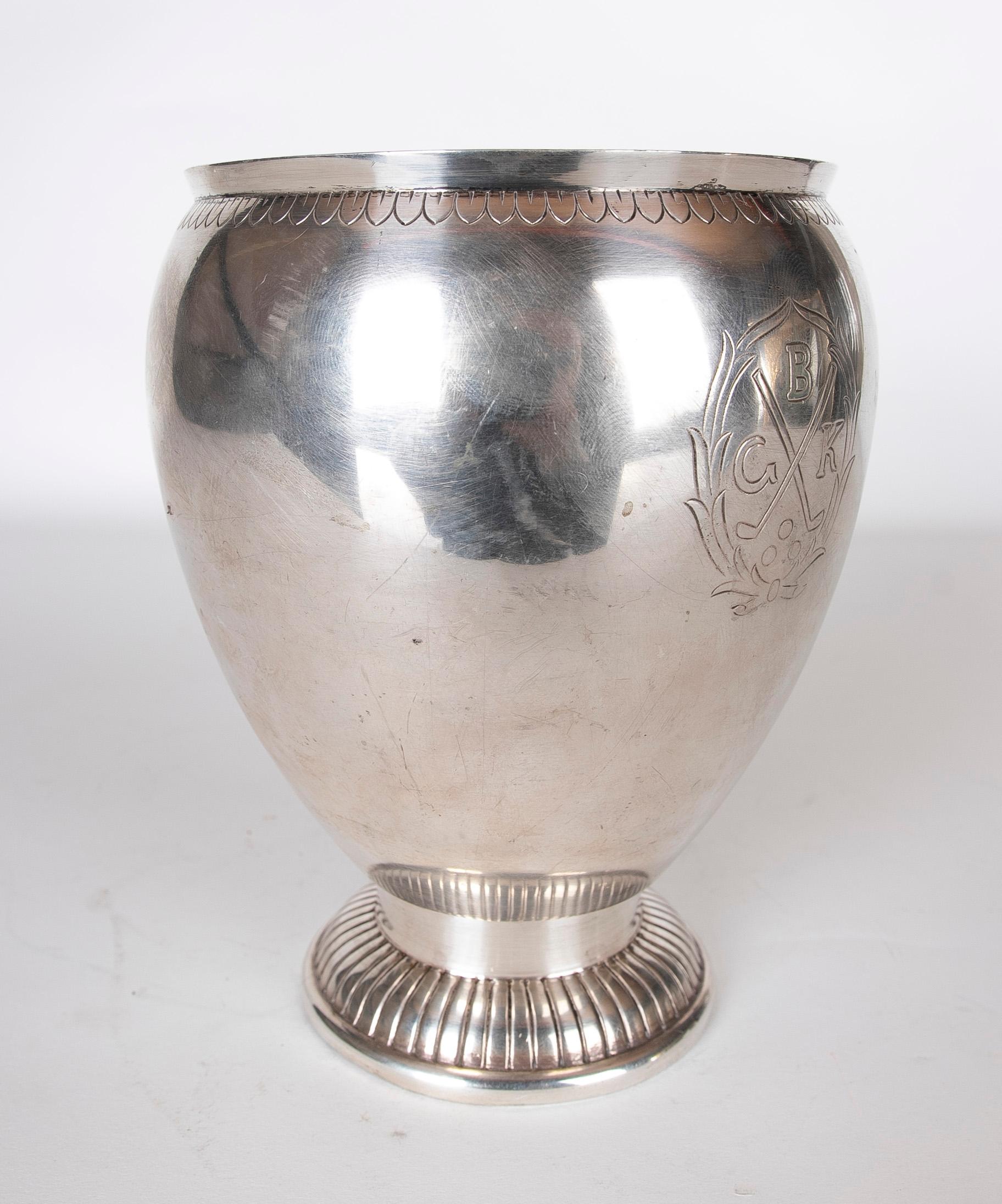 A silver cup from the Russian House of Bolin with shield decoration and lettering. 
The House of Bolin is one of the oldest Russian silver and jewellery firms to survive after the Russian Revolution and is still run by the founding family. The