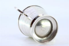 Silver cup with edge friezes, two applied handles and circular base