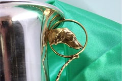 Silver cup with gold interior and handles with embossed dogs' heads