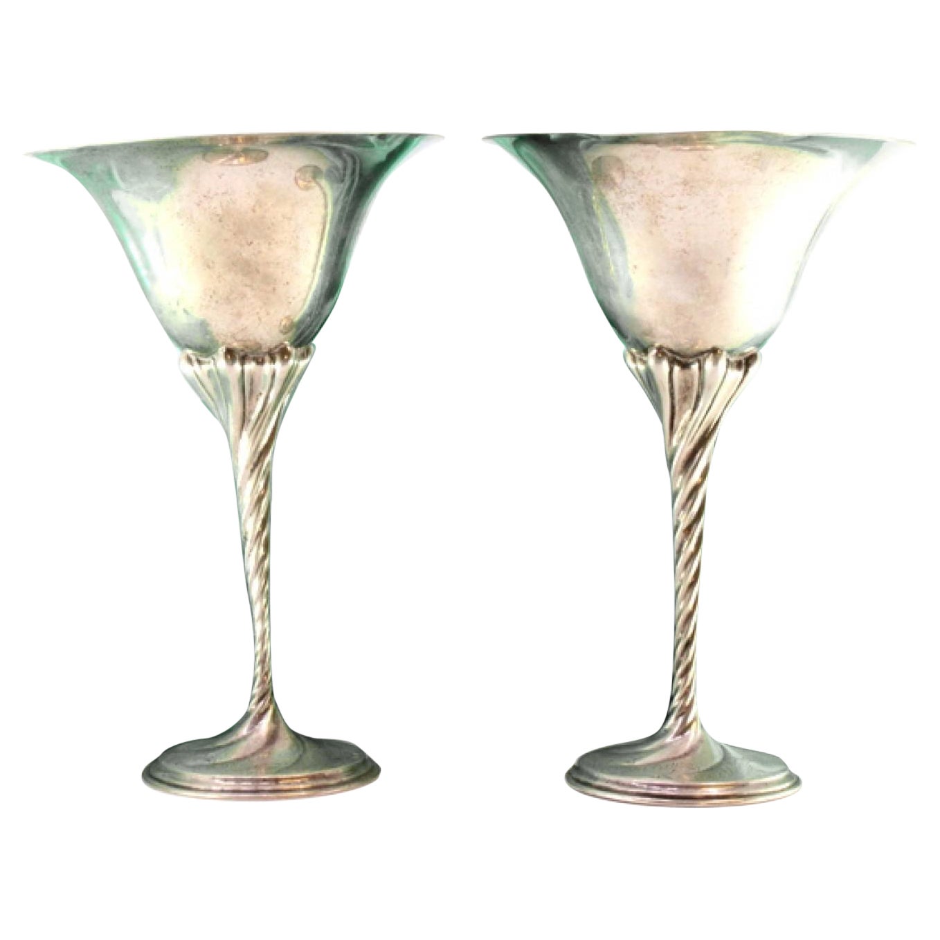 Silver cups w/ high stems 
twists on circular bases w/ engraved plant motifs For Sale