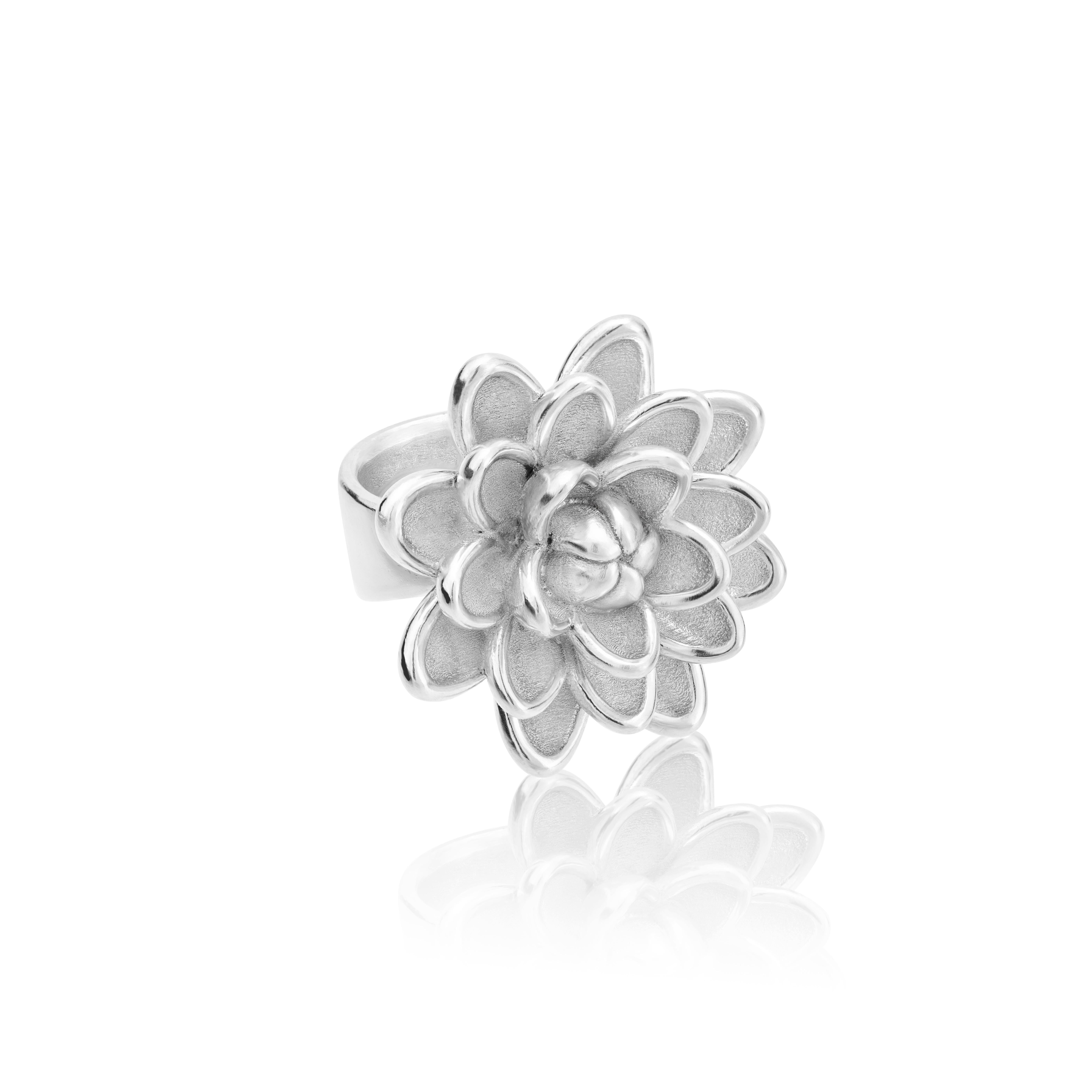 Inspired on the Dalia, Mexico's stunning national flower, this ring is delicately handmade in sterling silver.

Inspired by the Dahlia, Mexico’s beautiful national flower, this collection is presented in full Bloom with all the crowned circles