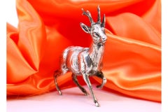 Silver deer in perfect relief and applications