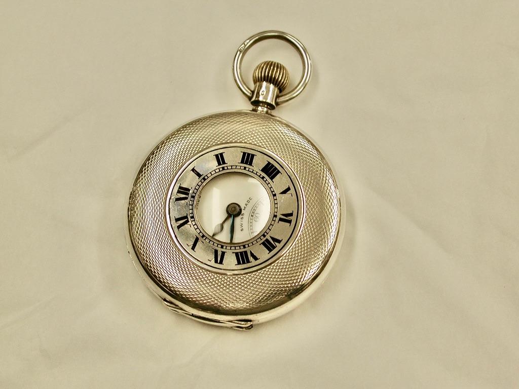 Silver Demi-Hunter pocket watch, Dated 1919, J W Benson, London
Both the case and movement are made by J W Benson of 62/64 Ludgate Hill.
Engraved with original owners initials
J W Benson was founded by two brothers, James William Benson and