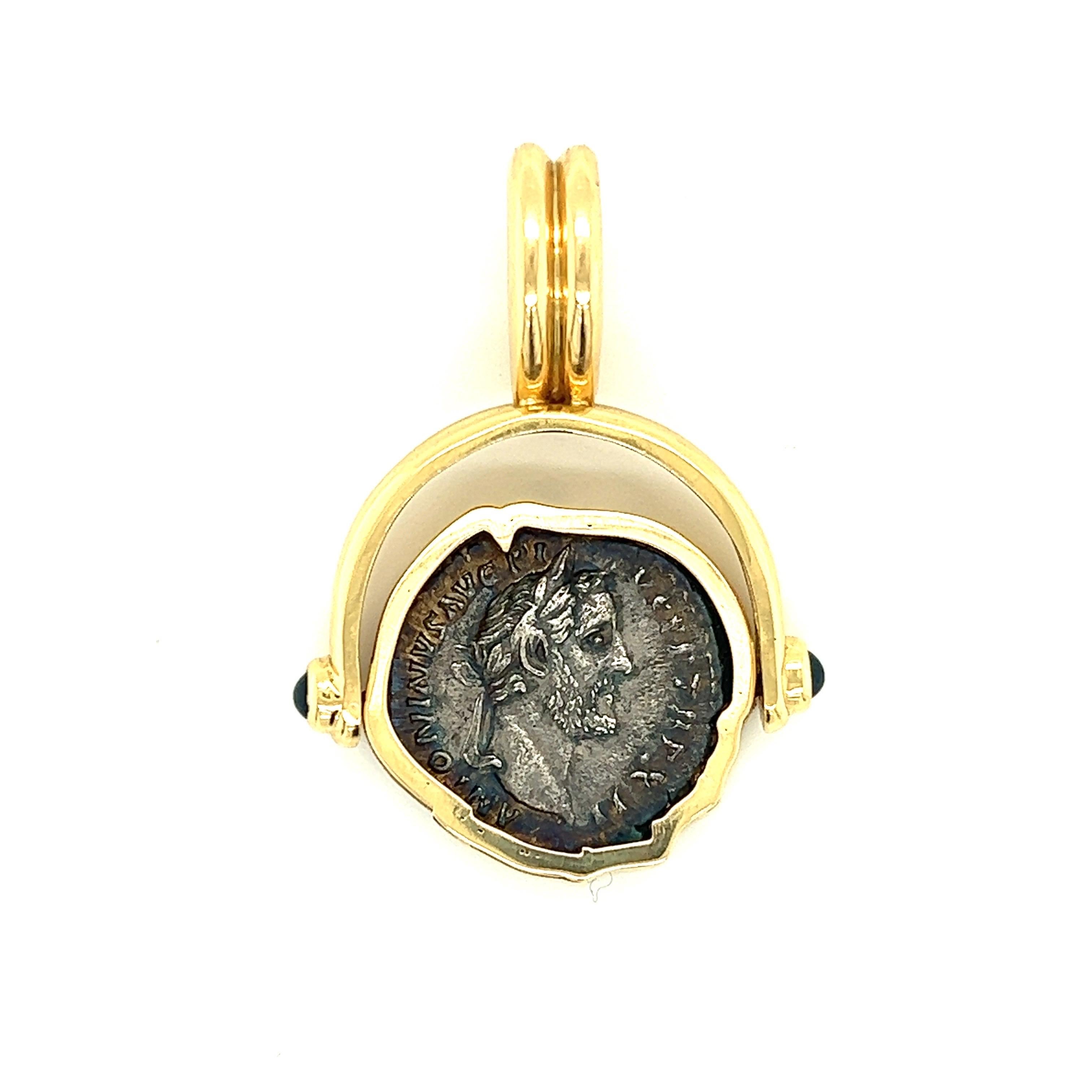 Introducing a captivating piece of history and luxury combined - a remarkable Silver Denarius Coin with an Antonius Pius flip pendant, elegantly presented in an 18k yellow gold bezel. This extraordinary artifact seamlessly merges the ancient world