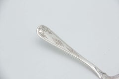Silver dessert spatula with cutouts