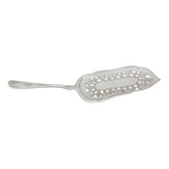 Silver dessert spatula with cutouts