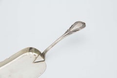 Silver dessert spatula with embossed handle