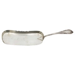 Silver dessert spatula with embossed handle