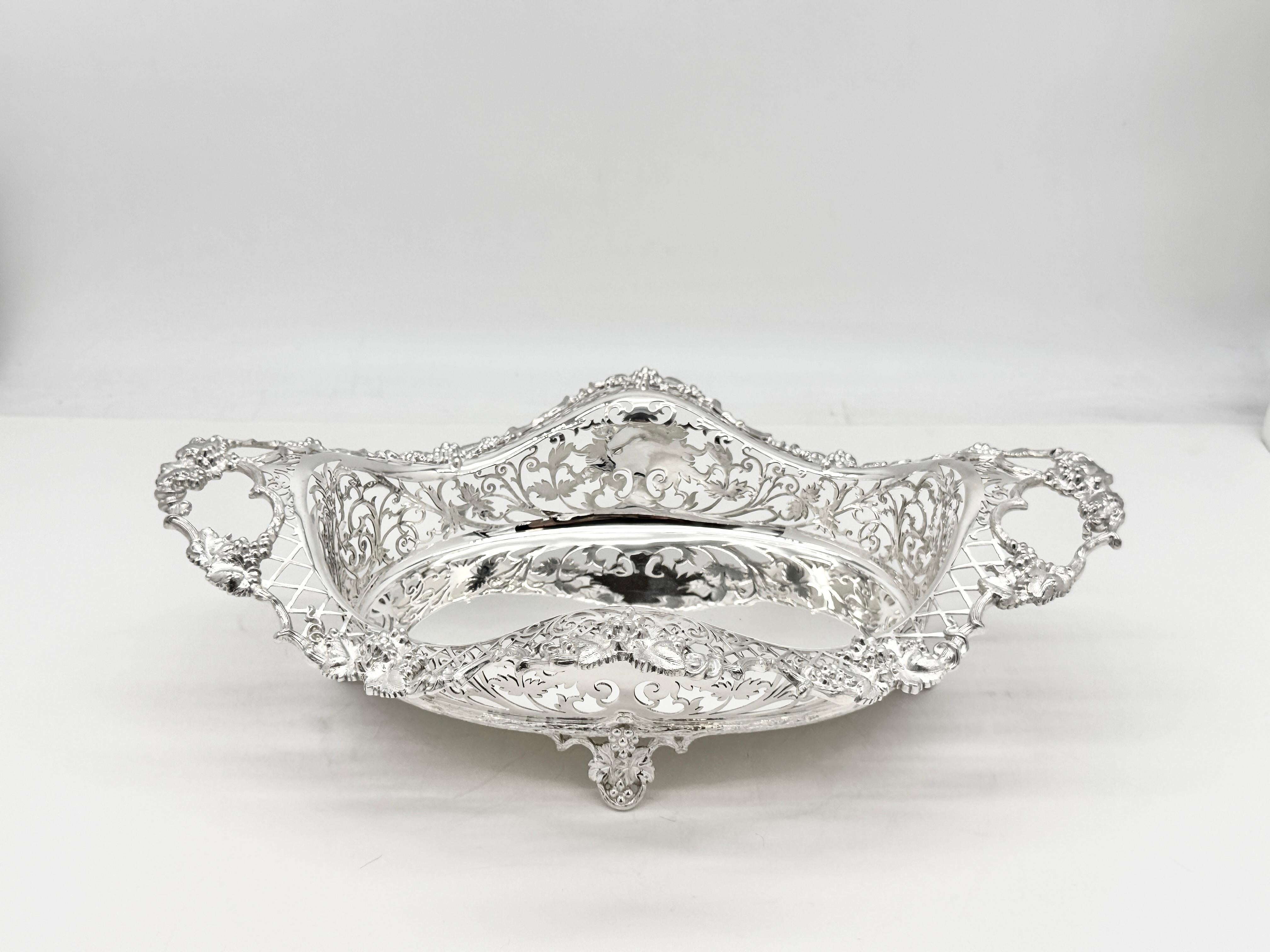 Beautifully pierced silver dish standing on 4 feet.
The border and handles is wonderfully decorated with grapes and leaves
This dish/basket weighs 1162g