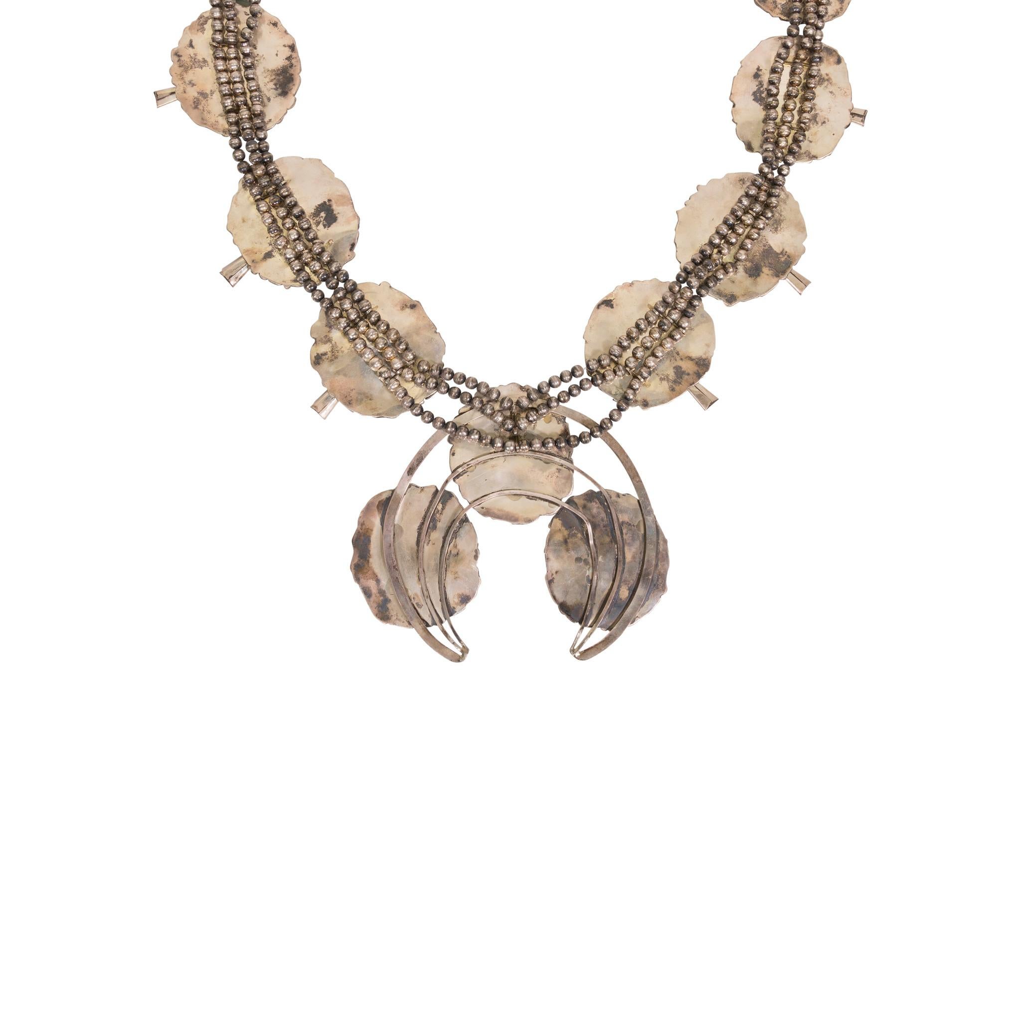 Exceptional Navajo silver dollar squash blossom necklace. Crafted in 1925 for a special occasion/pow wow. Eleven 3