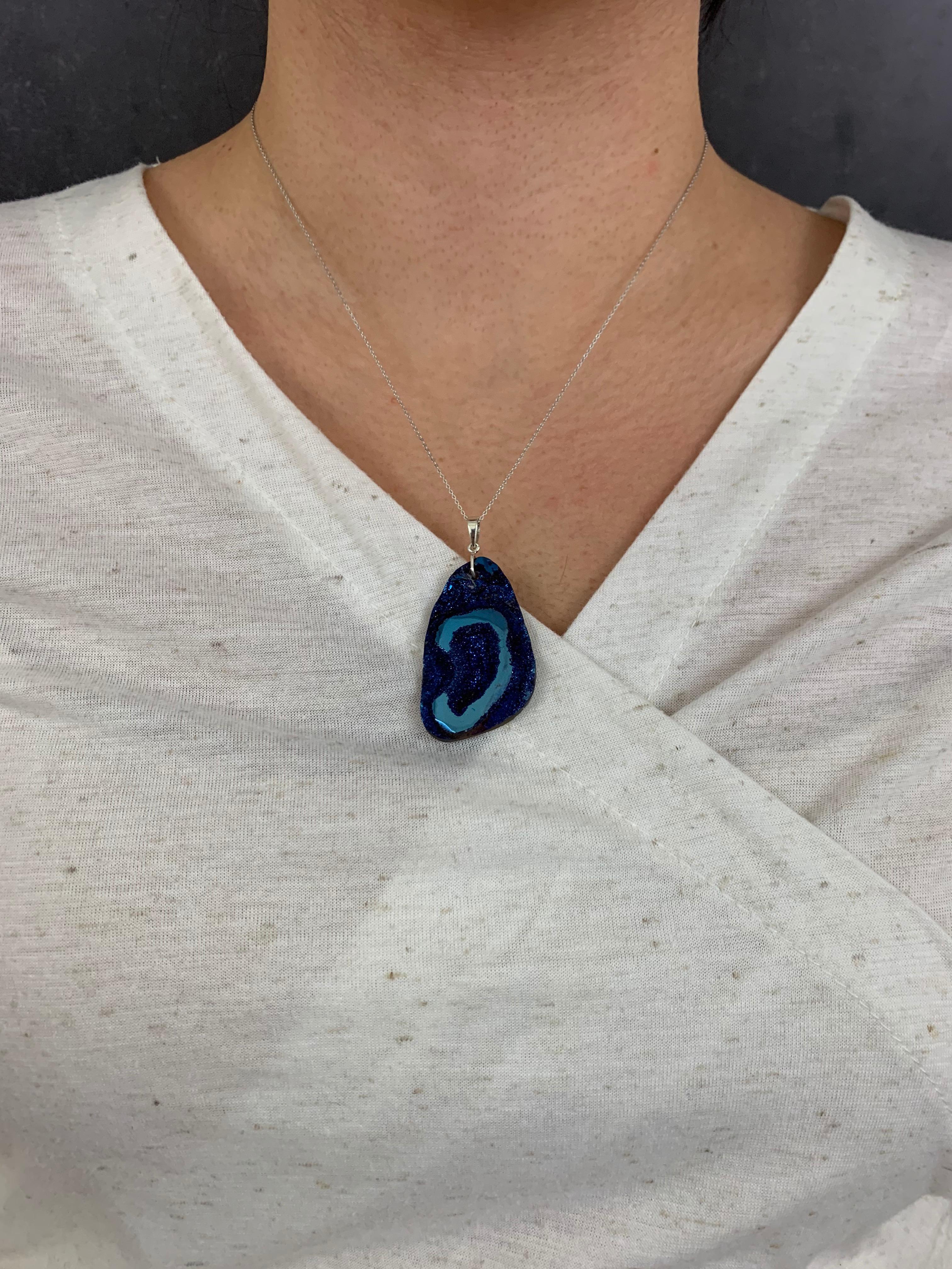 A unique, large blue druzy on silver!
Measuring approximately 1.75 inches x 1 inch. 

Fine one-of-a-kind craftsmanship meets incredible quality in this breathtaking piece of jewelry.