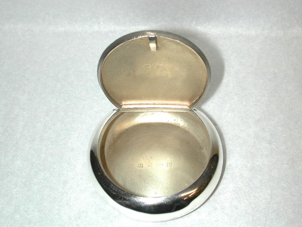 Silver Edwardian Tobacco Box with Sprung Flip Up Lid, dated 1902, Birmingham
This box was made by A & J Zimmermann and could be used for anything these days.
It is a nice heavy gauge of silver and needs to be held in one hand and then squeezed at