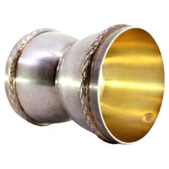 Silver egg holder with two dimensions and double frieze on the edge