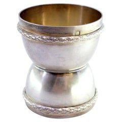 Silver egg holder with two dimensions and double frieze on the edge