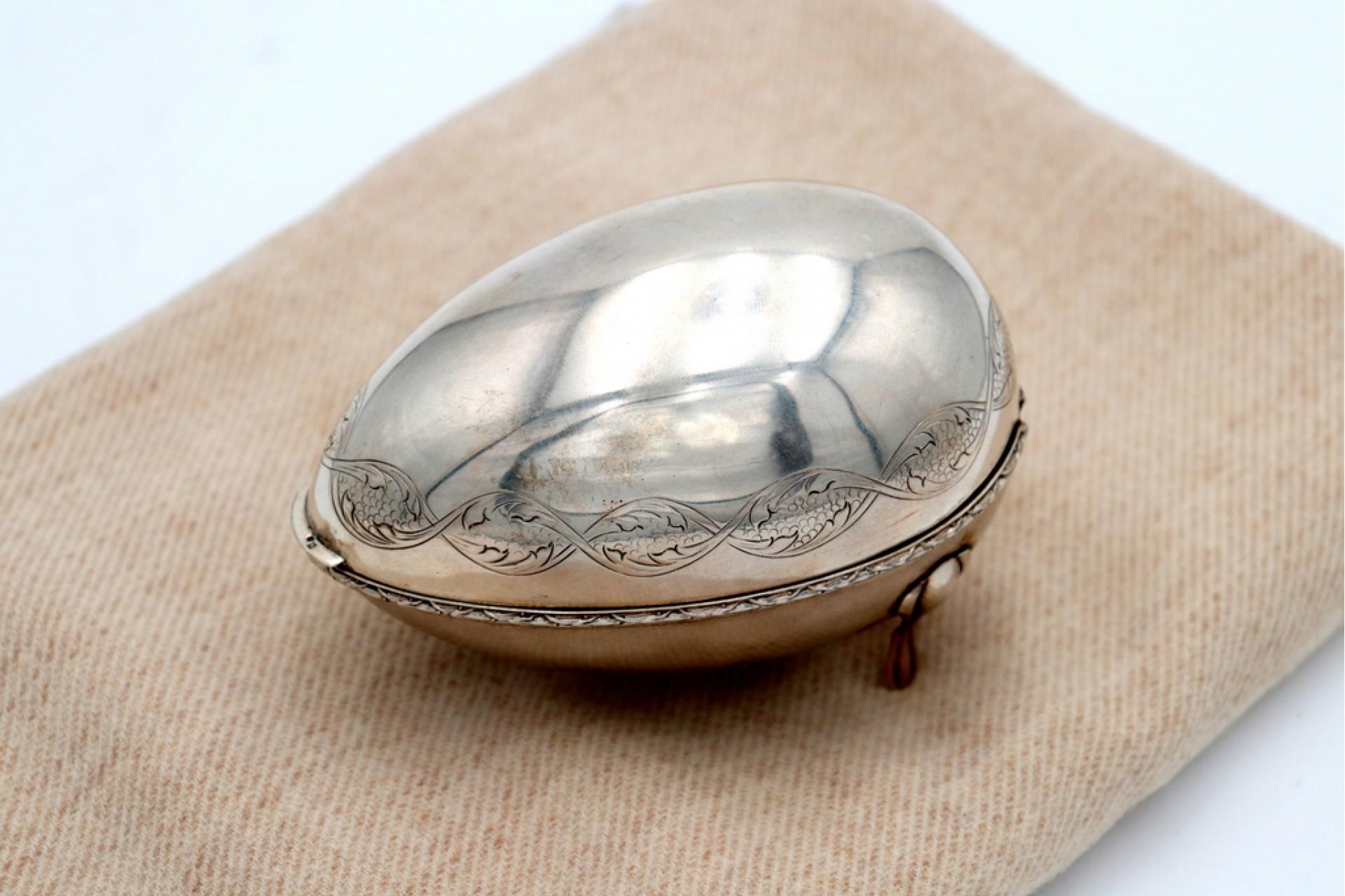 Silver egg-shaped soap dish