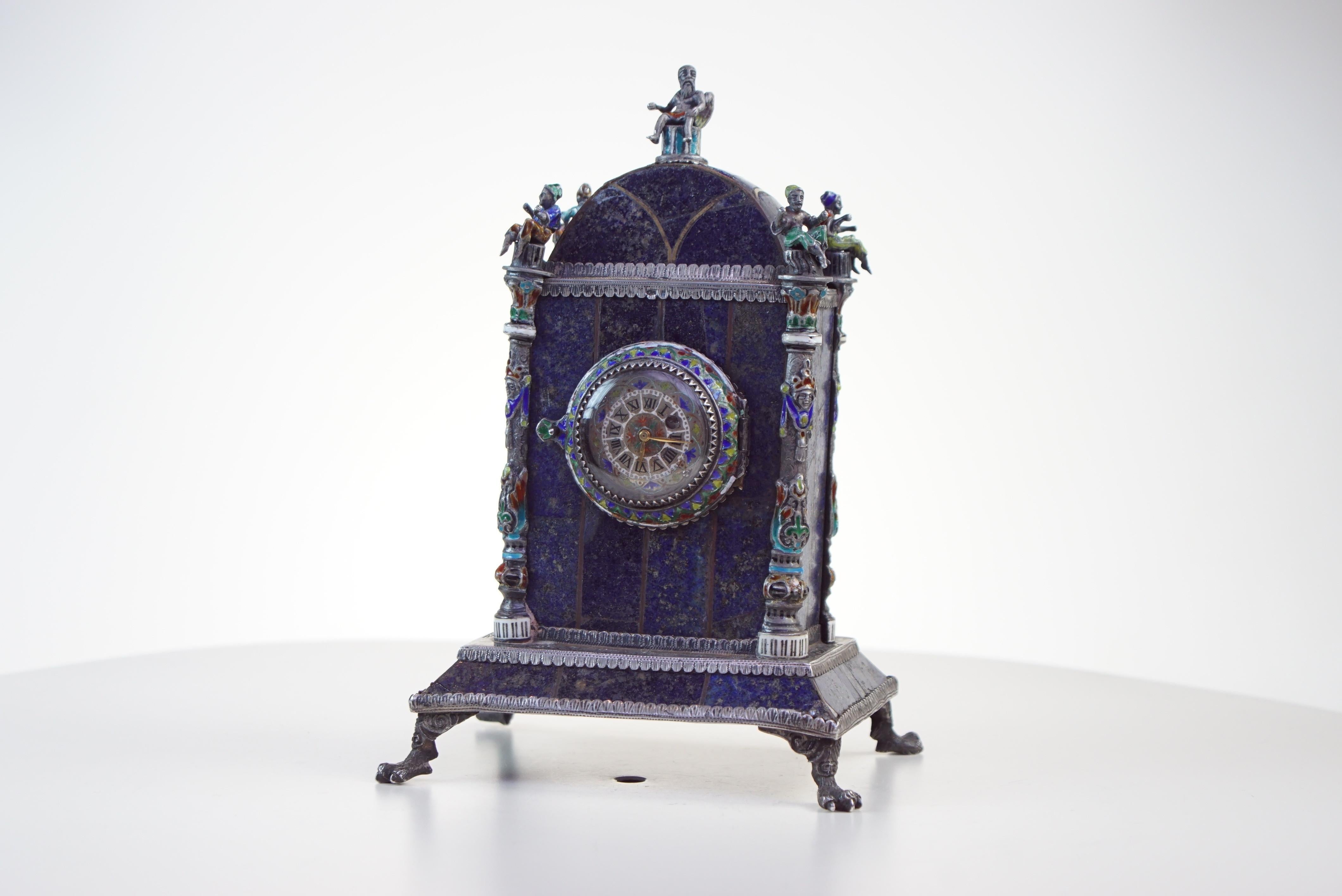 Silver, enamel, and Lapis Lazuli table clock by Hermann Bohm

Lapis Lazuli silver and enamel clock made by Hermann Boehm circa 1880s in Austria. Amazing master-work all handmade by solid silver, Lapis Lazuli and enamel. Silver enameled dial with