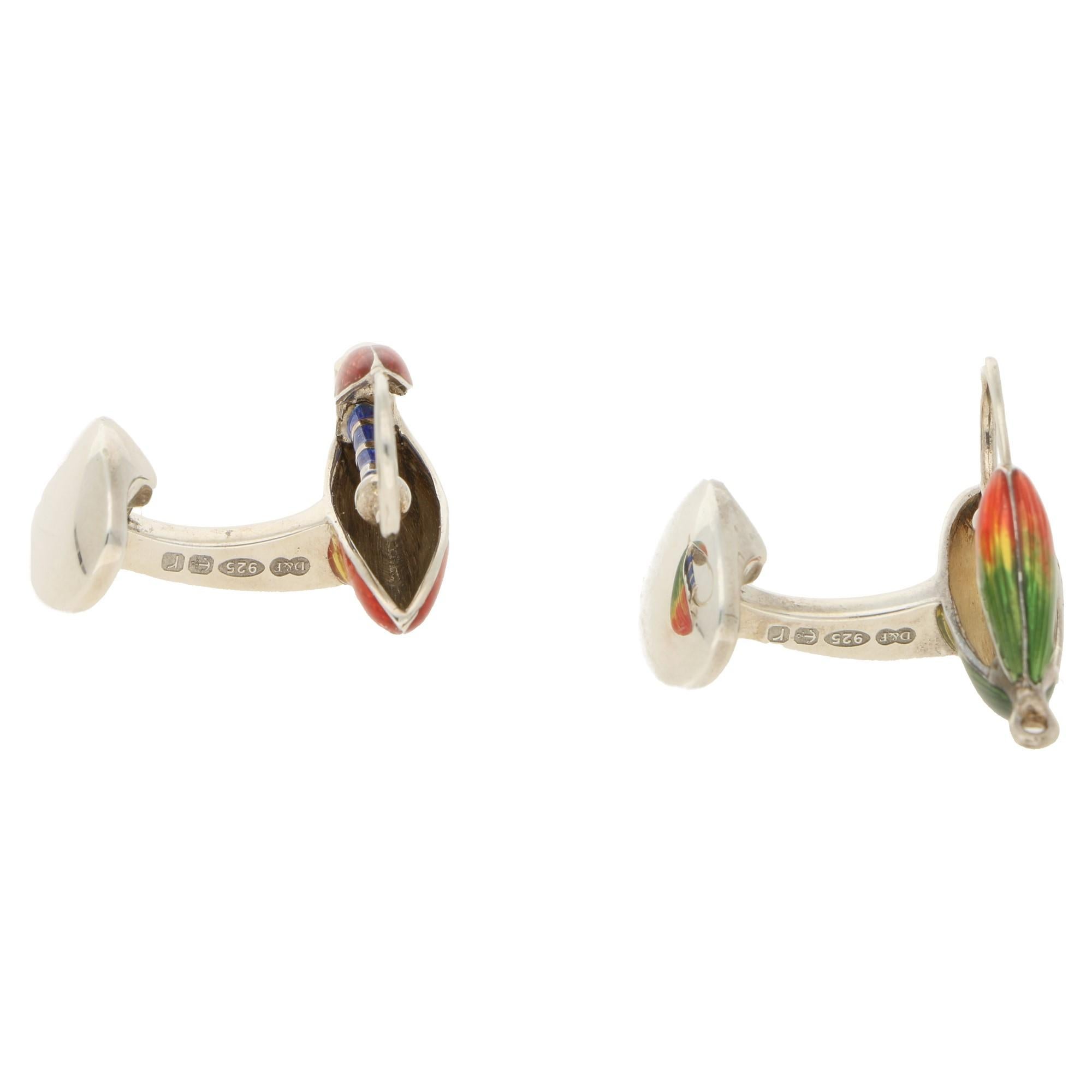A fine pair of fly fishing cufflinks in silver with vibrant enamel work. With a domed oval spring link fitting, carrying full hallmarks.