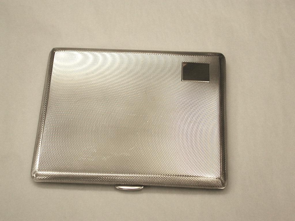 Silver engine-turned cigarette case made in 1969, Birmingham, by S.J.Rose
Weighing 6.31 Troy ounces, with a square cartouche for engraving personal initials.
The engine turn has no wear what so ever, with gilding inside and original 
gold plated