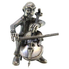 Silver figure of a musician playing the cello