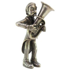 Silver figure of a musician playing the euphonium