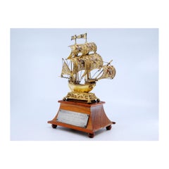 Silver filigree caravel w/ enameled crosses on the sails & set on a wooden base