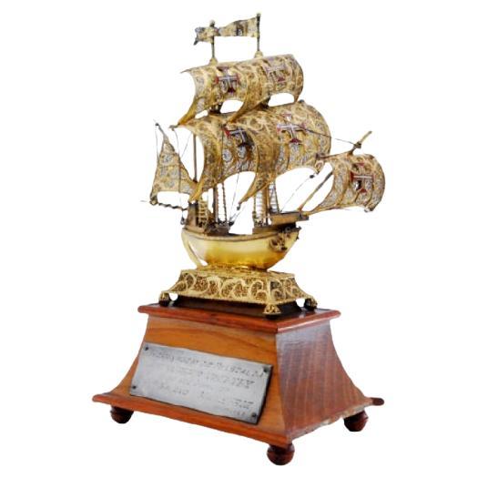 Silver filigree caravel w/ enameled crosses on the sails 
set on a wooden base For Sale