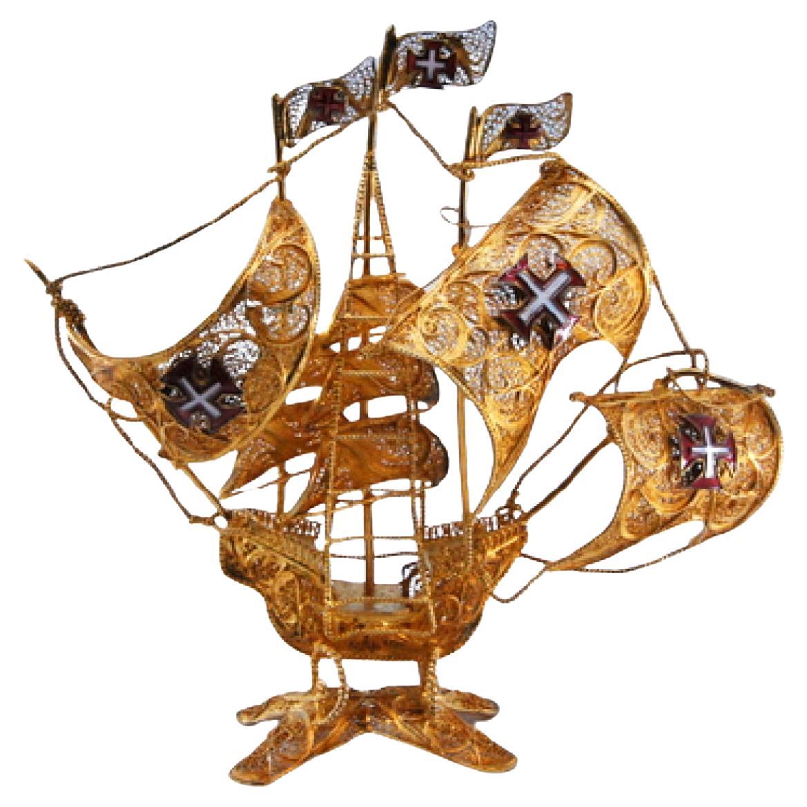 Silver filigree caravel with enameled sails and cut-out base