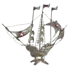 Silver filigree caravel with three flags and Portuguese symbols