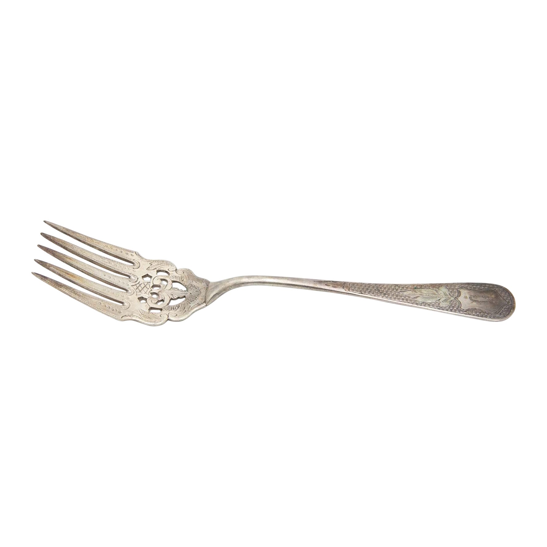 Silver fish fork with cutouts