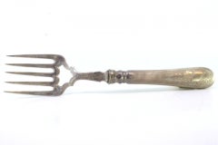 Silver fish fork with floral reliefs and monogrammed handle card
