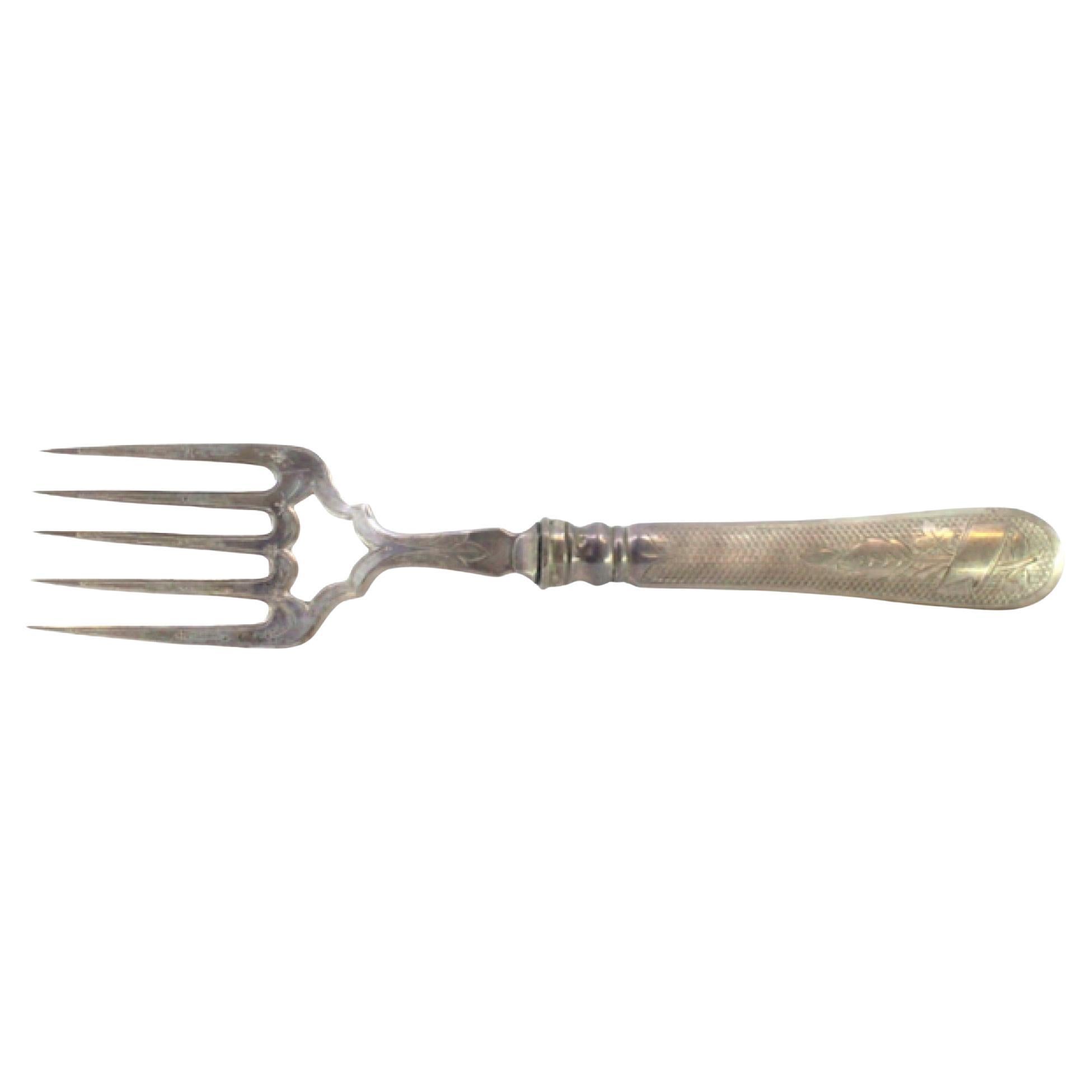 Silver fish fork with floral reliefs and monogrammed handle card
