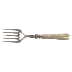Silver fish fork with floral reliefs and monogrammed handle card