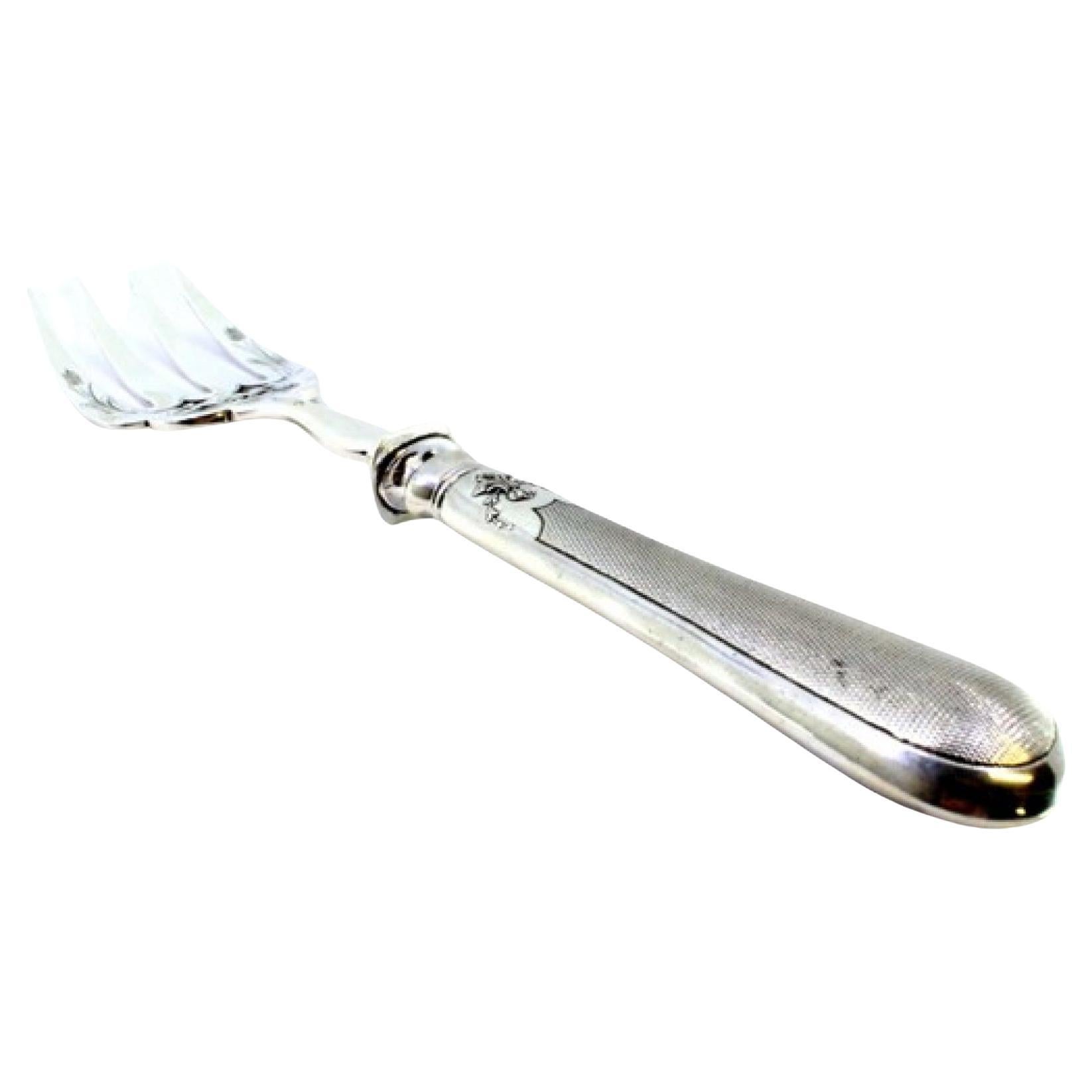 Silver fish fork with reliefs, engravings and guilloche monogram handle