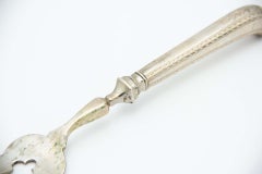 Silver fish fork with stripes and acanthus engraving on pistol handle