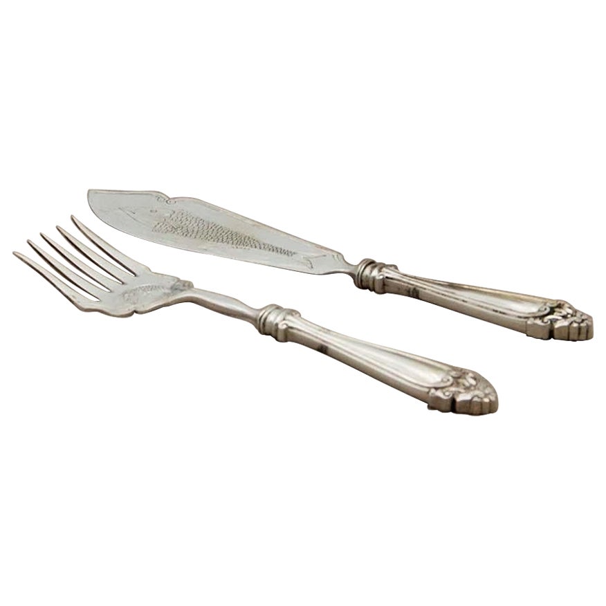 Silver fish knife and fork with engraving and raised handles