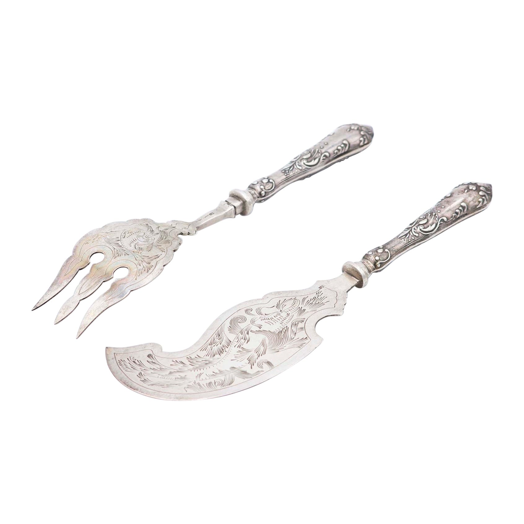 Silver fish knife and fork with engraving on the blades