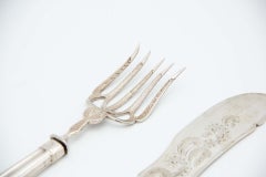 Silver fish knife and fork with reliefs, engravings and fluted handles