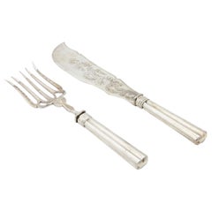 Silver fish knife and fork with reliefs, engravings and fluted handles